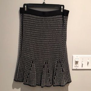 Ann Taylor black skirt with white accent details! New with Tags! Size Medium.